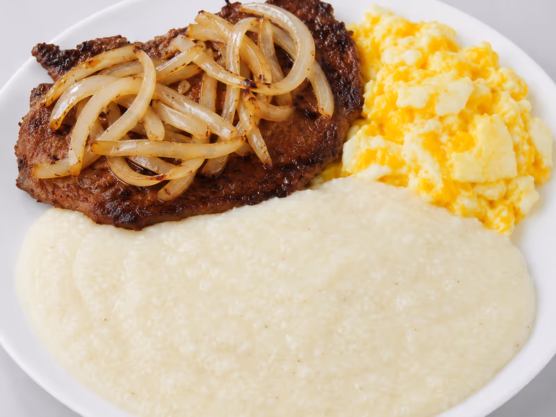 Grilled Beef Steak with Eggs at Dinner Is Served restaurant in Miami